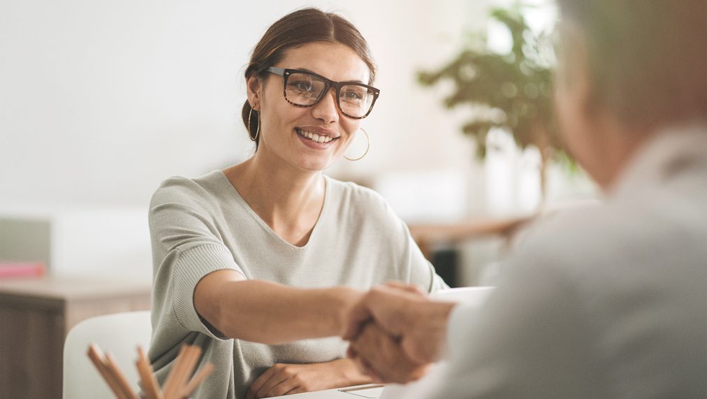 Advisor and client shaking hands